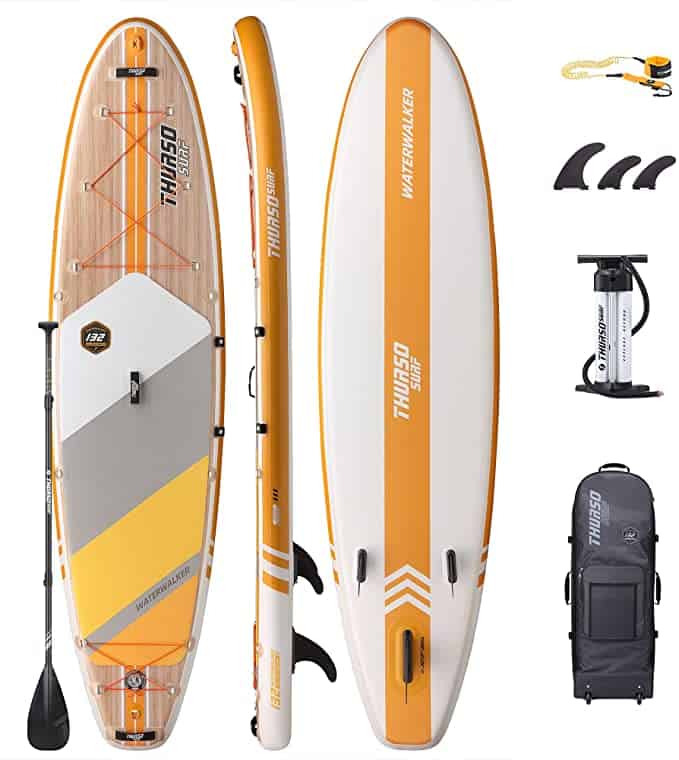 An orange and white SUP with a paddle.