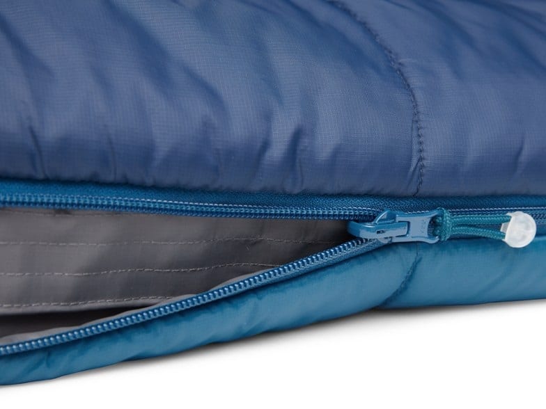 A close up of a zipper on a camping sleeping bag.