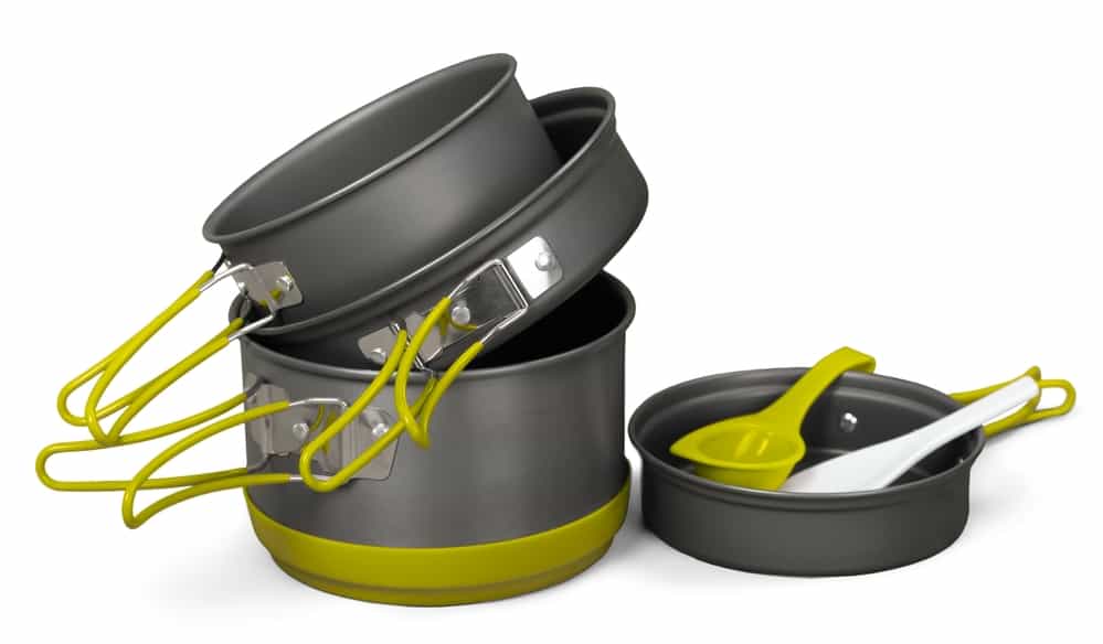 Essential camping accessories: a couple of pots and pans sitting next to each other.