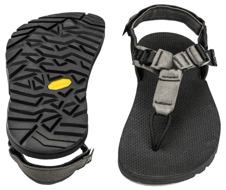 a pair of black sandals with yellow soles.