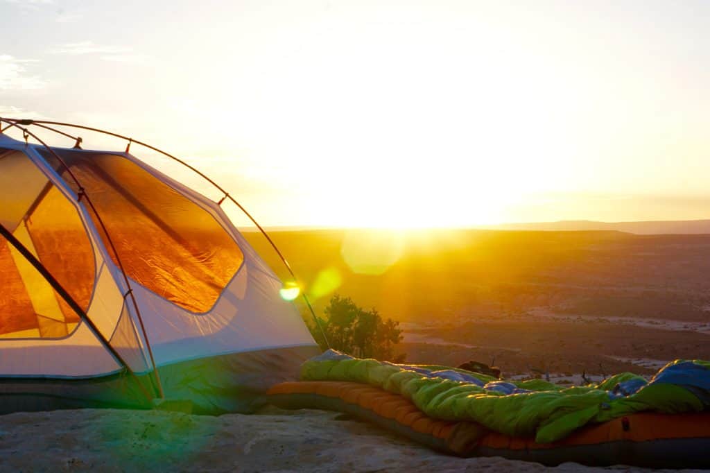 a tent with a sleeping bag on top of it.