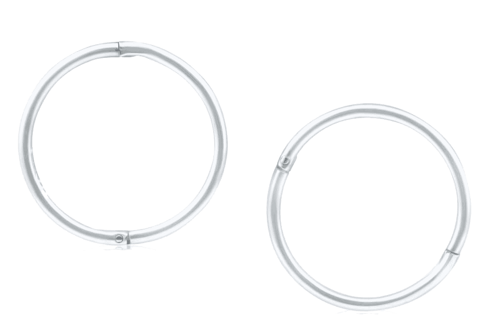 a pair of silver hoop earrings on a white background.