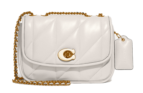 a white handbag with a gold chain strap.