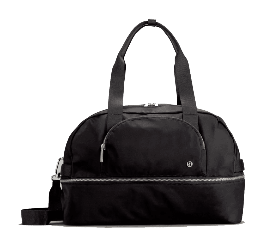 a black duffel bag on a green background.