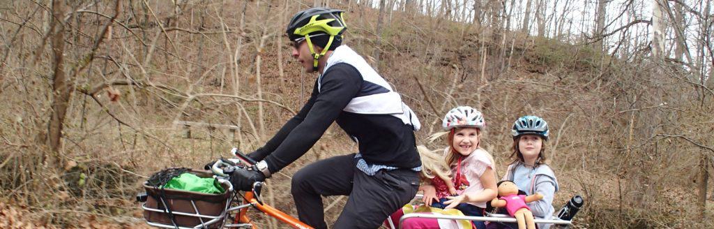 father-biking-with-kids