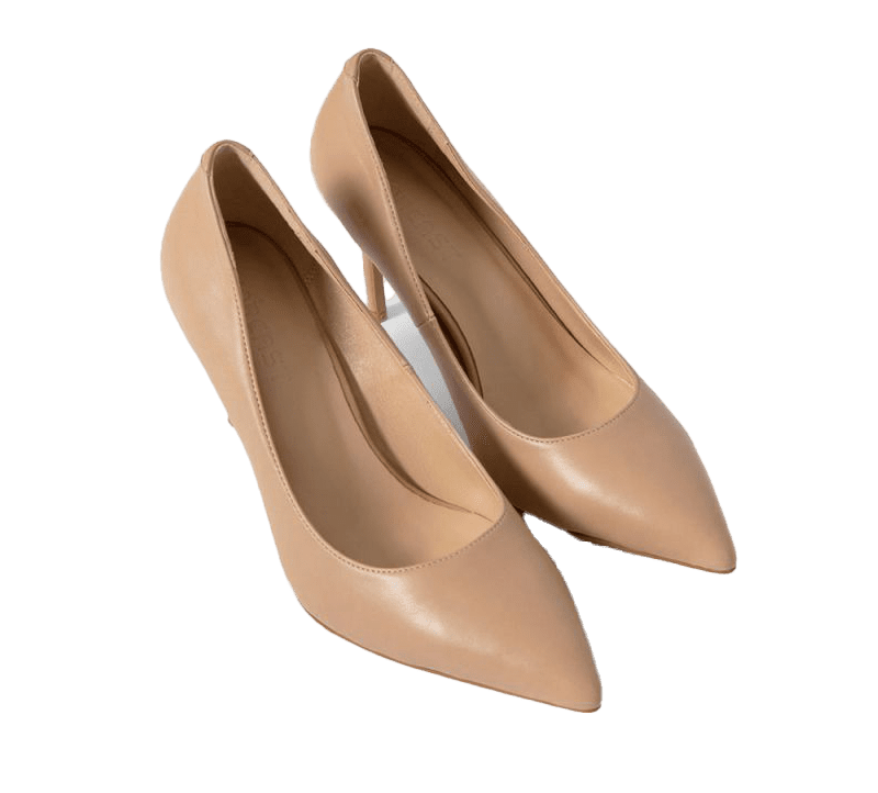 a pair of nude colored shoes on a green background.