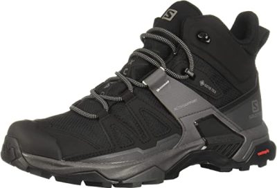 a pair of black hiking shoes on a white background.
