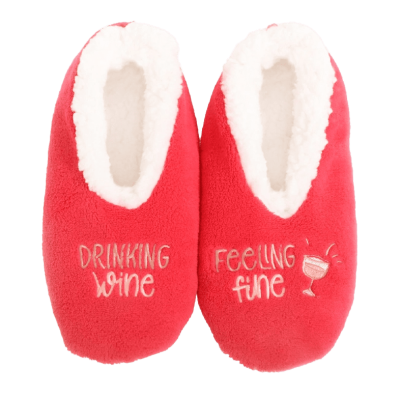 a pair of red slippers with writing on them.