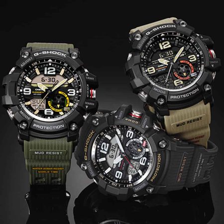A pair of Best Adventure wrist watches resting on a table.